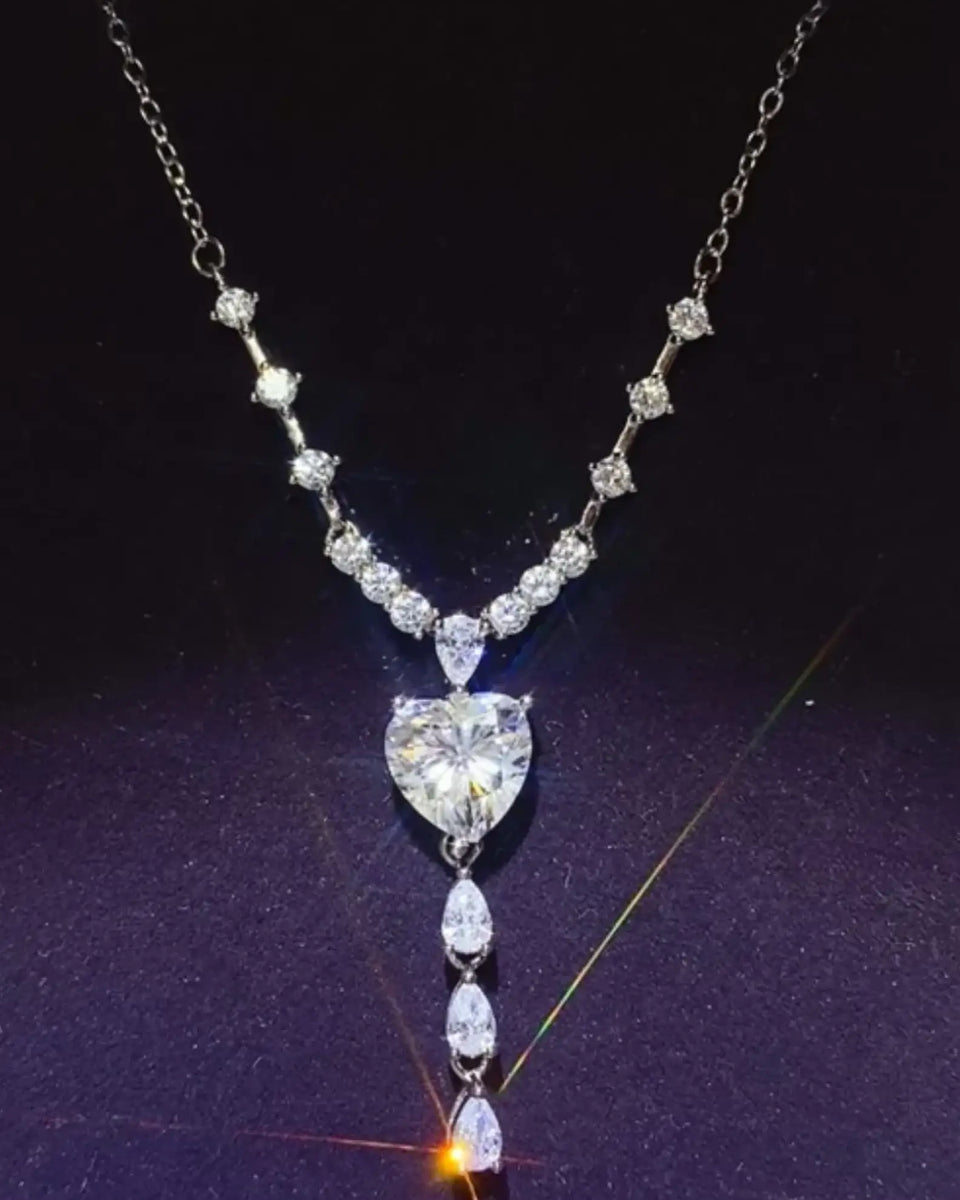 Brilliant 3 Carat Sterling Silver Necklace with Heart Pendant3 carat sterling silver necklace with heart-shaped and teardrop crystals on silver chain