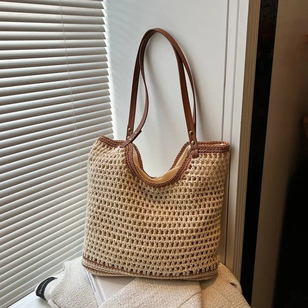 Trendsi crochet tote bag with leather handles in beige and brown hanging near window blinds
