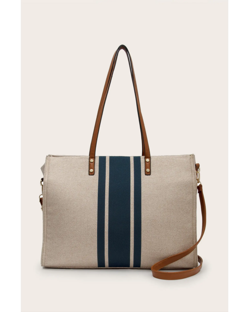Cruise Wear Striped Tote Bag with beige fabric and vertical navy blue stripes with brown leather straps