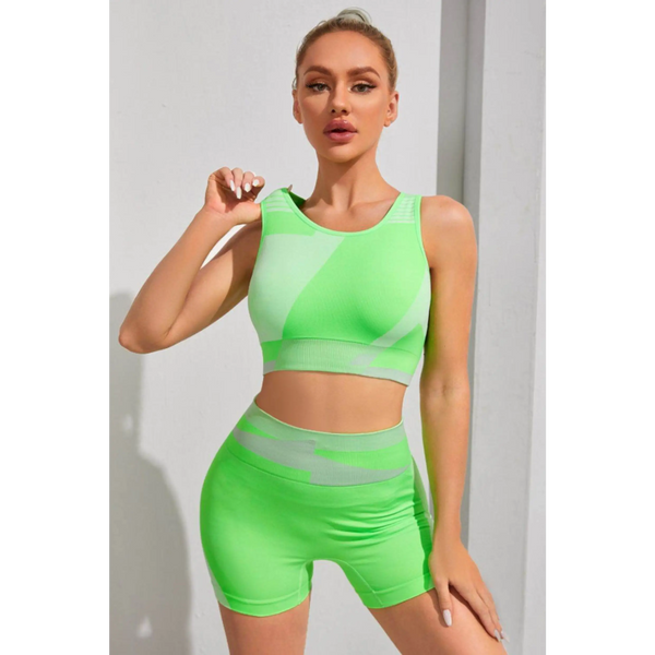 Babe Beachwear neon green color block sports bra and shorts set on woman posing indoors