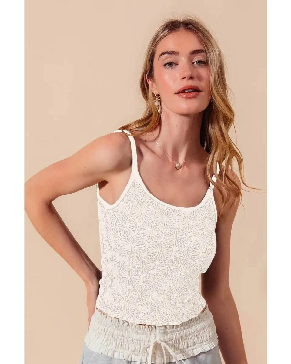 Babe Beachwear floral seamless tank top in white worn by model with light hair and beige background