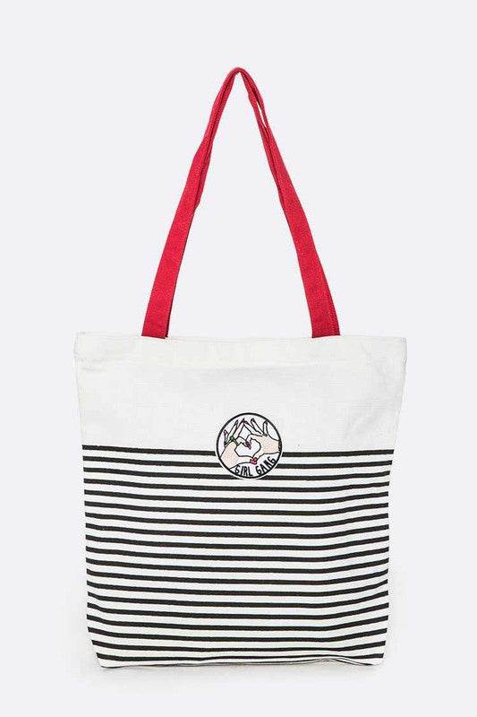 Studio image Babe Beachwear girl gang canvas tote bag with black stripes and red handles