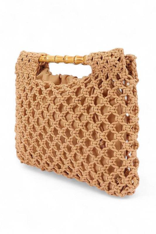 Artini Accessories crochet bamboo handle clutch in tan with intricate woven design and bamboo handles studio image