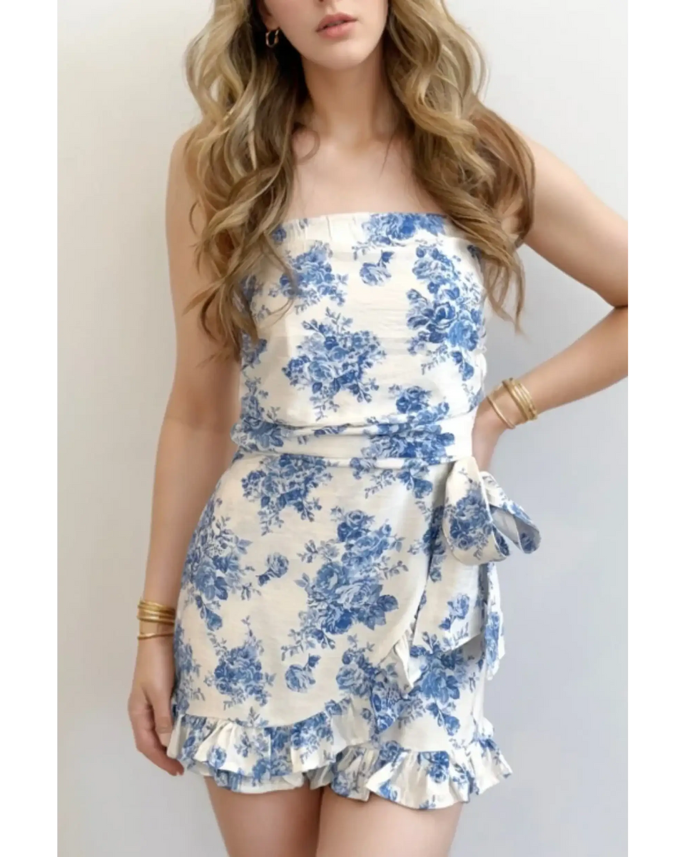 Trendsi junior size strapless ruffle hem romper with blue floral print and side bow detail