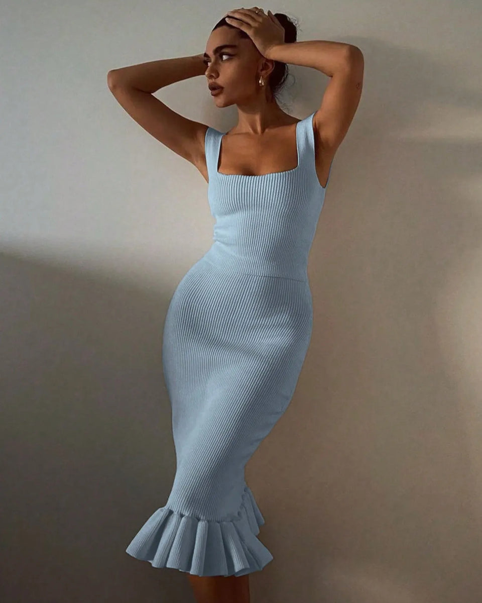 model wearing light blue ribbed maxi mermaid dress with square neckline and ruffled hem