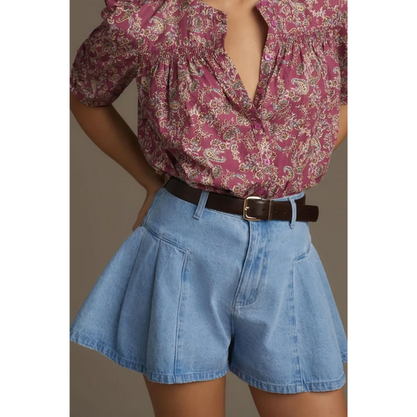 Trendsi pleated wide leg denim shorts in light blue worn with a floral blouse and brown belt
