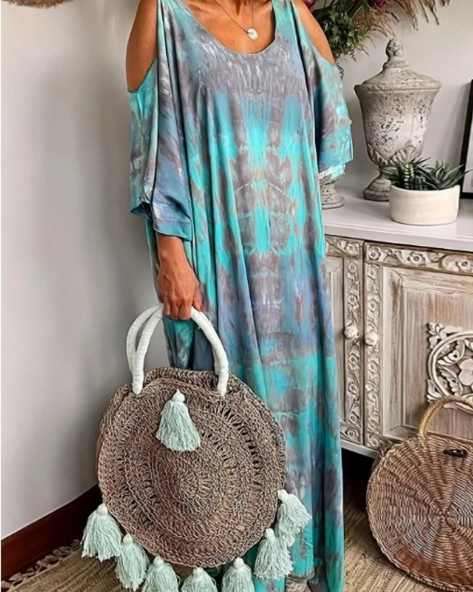 Trendsi plus size tie dye maxi dress in blue and gray with cold shoulder design and round rattan tassel bag