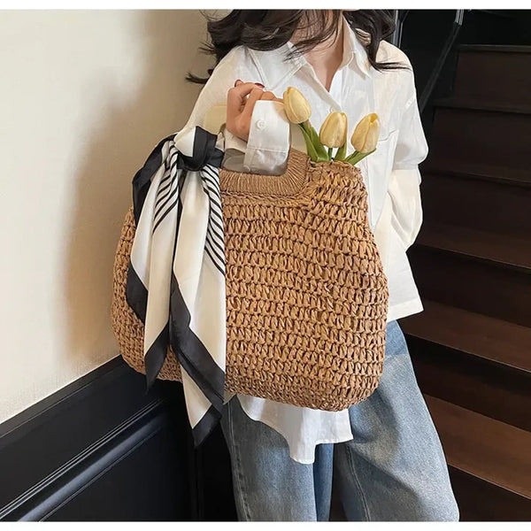 woven straw bag with black and white scarf and tulips perfect resort wear accessories for women