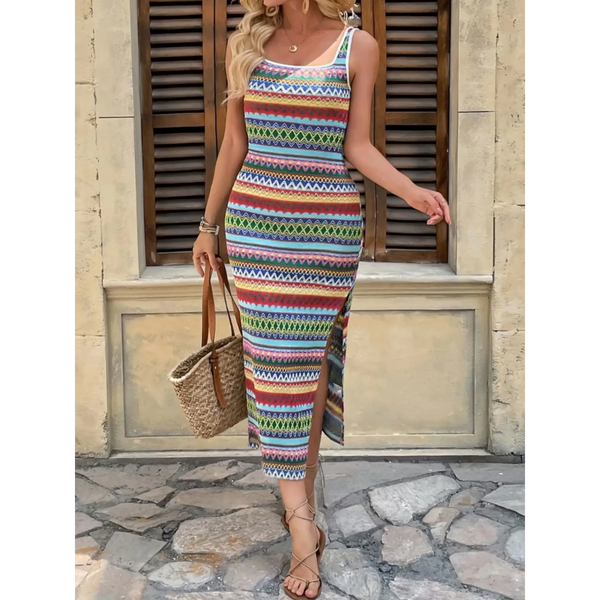 Woman wearing colorful Tropical Stripes Knit Midi Dress with side slit and carrying a straw bag
