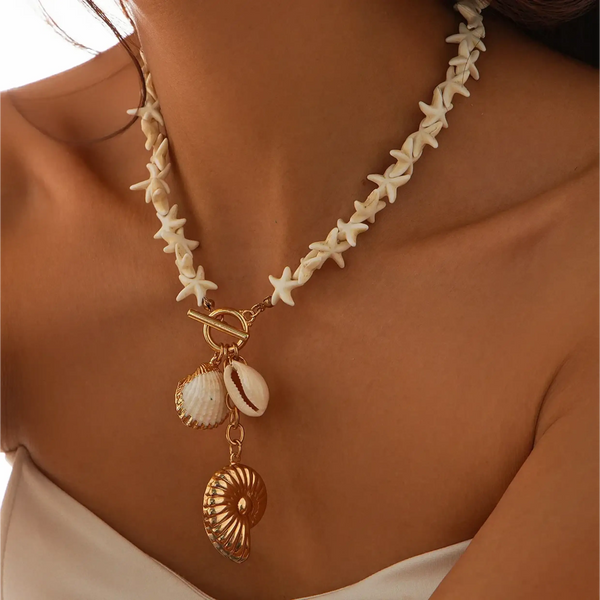 Fashionable Shell Resort Necklace by Trendsi featuring starfish and gold shell charms on model's neck