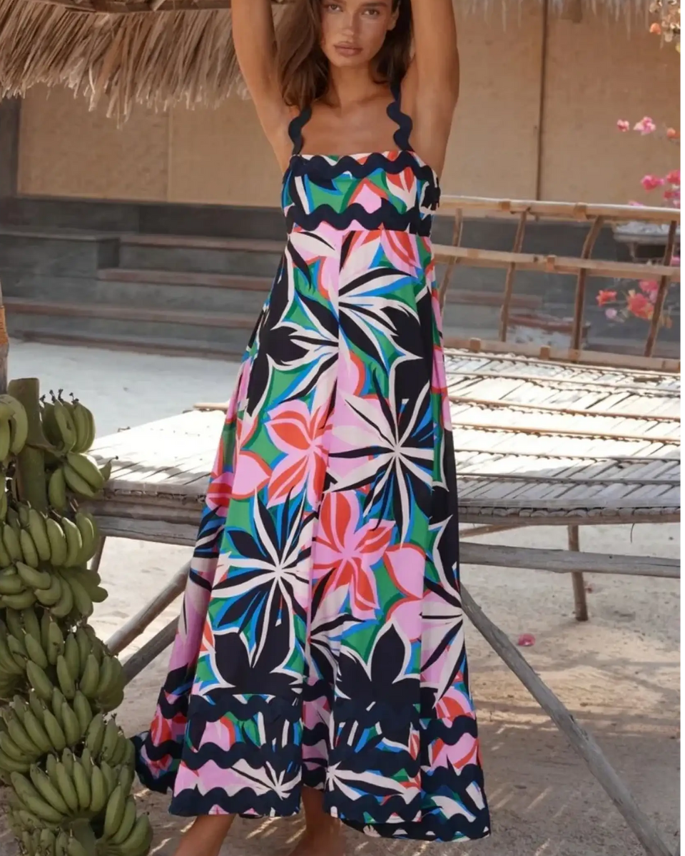 Trendsi maxi dress featuring a colorful floral pattern on a navy blue resort dress perfect for beach vacations