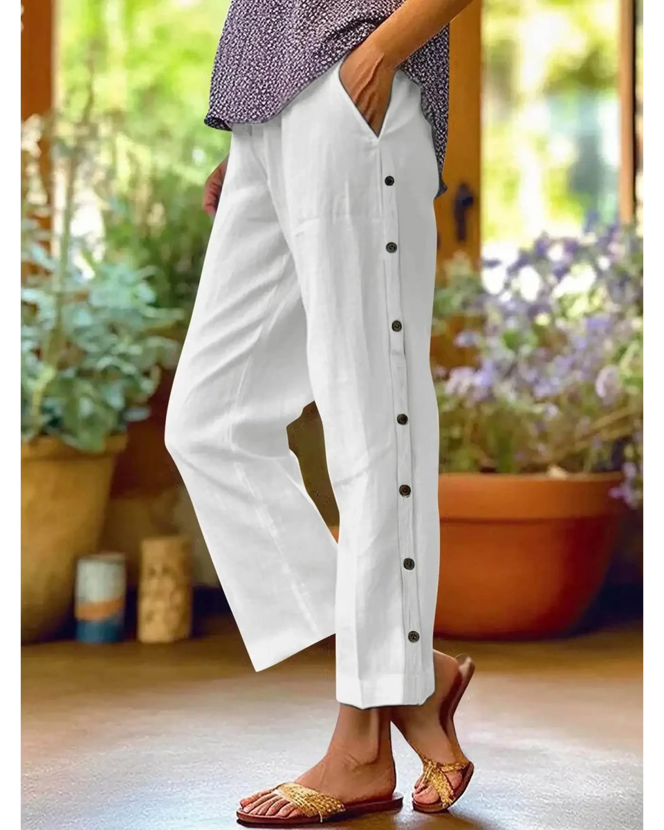 woman wearing Babe Beachwear women's casual white vacation pants with side buttons and relaxed fit