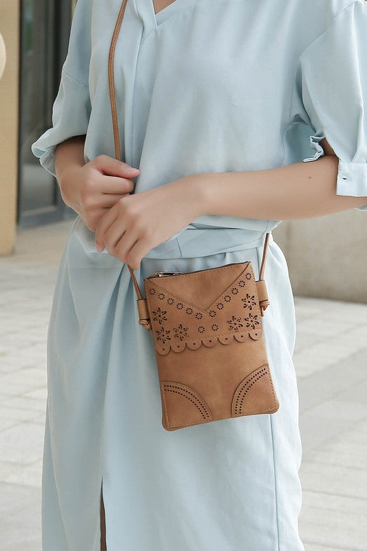 MKF Collection by Mia K women's crossbody beach bag in tan with floral cutout design and adjustable strap