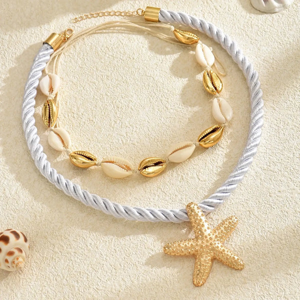 beautiful rope necklace with a star fish and shells in gold 