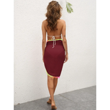 Beach Babes burgundy coverup skirt with colorful trim worn on model from back