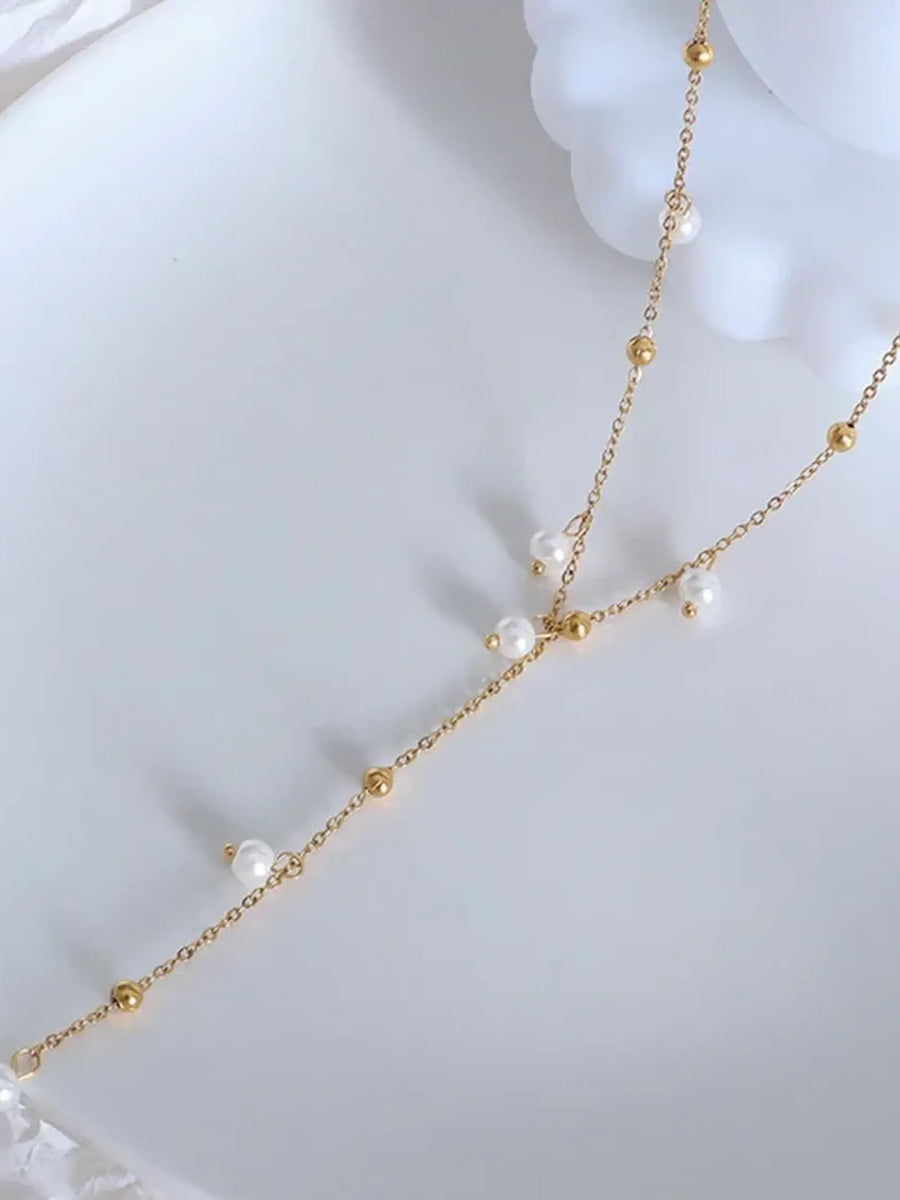 Elegant 18K gold plated pearl necklace with delicate chain and small white pearls