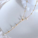 Elegant 18K gold plated pearl necklace with delicate chain and small white pearls