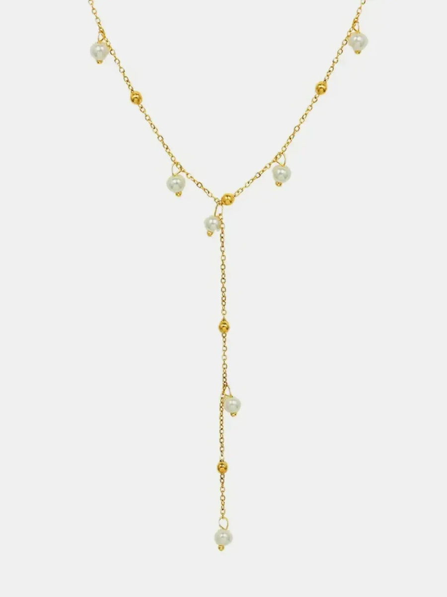 Delicate 18K gold plated pearl necklace with small pearls and gold bead accents in a Y-shaped design