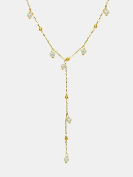 Delicate 18K gold plated pearl necklace with small pearls and gold bead accents in a Y-shaped design