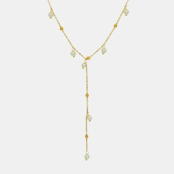 Delicate 18K gold plated pearl necklace with small pearls and gold bead accents in a Y-shaped design