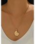 18K gold shell pendant necklace by Trendsi worn around neck with delicate chain and spiral shell charm