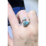 Babe Beachwear 2 carat pear shaped Bypass ring sparkle worn on finger with blue pear shaped and round gems