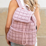 Babe Beachwear pink Puffer Backpack Lightweight worn by woman with white top and jeans