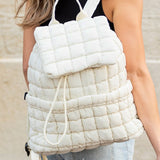 Babe Beachwear white Puffer Backpack Lightweight quilted design worn by a woman with blonde hair