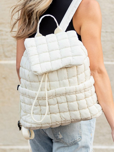Babe Beachwear white Puffer Backpack Lightweight quilted design worn by a woman with blonde hair