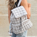 Babe Beachwear Puffer Backpack Lightweight in white worn by woman with casual outfit