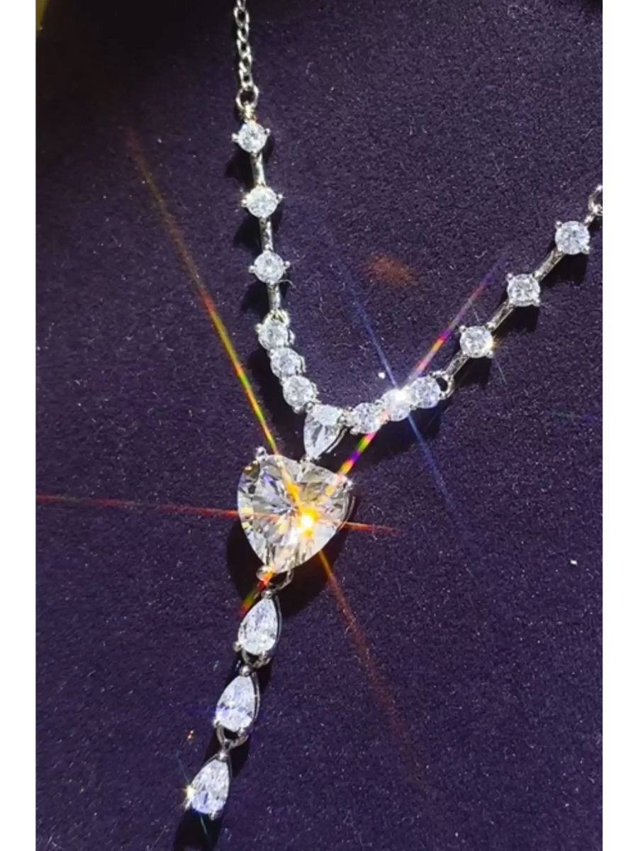 Brilliant 3 Carat Sterling Silver Necklace with Heart Pendant3 carat sterling silver necklace with heart-shaped and round sparkling stones on a delicate chain