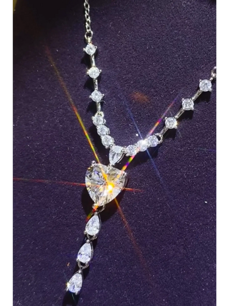 Brilliant 3 Carat Sterling Silver Necklace with Heart Pendant3 carat sterling silver necklace with heart-shaped and round sparkling stones on a delicate chain