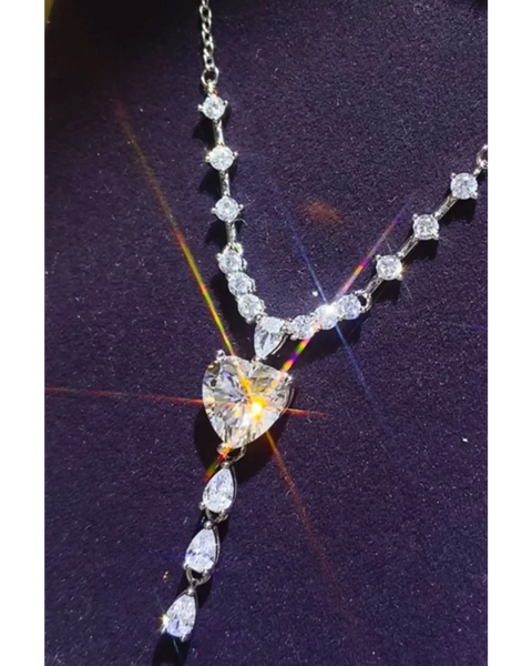 Brilliant 3 Carat Sterling Silver Necklace with Heart Pendant3 carat sterling silver necklace with heart-shaped and round sparkling stones on a delicate chain