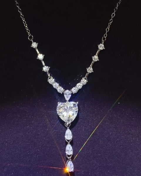 Brilliant 3 Carat Sterling Silver Necklace with Heart Pendant3 carat sterling silver necklace with heart-shaped and teardrop crystals on silver chain