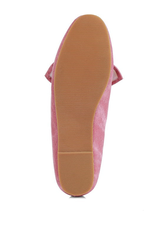 Sole view of women's denim bow loafers by Rag Company in pink with textured rubber outsole