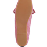 Sole view of women's denim bow loafers by Rag Company in pink with textured rubber outsole