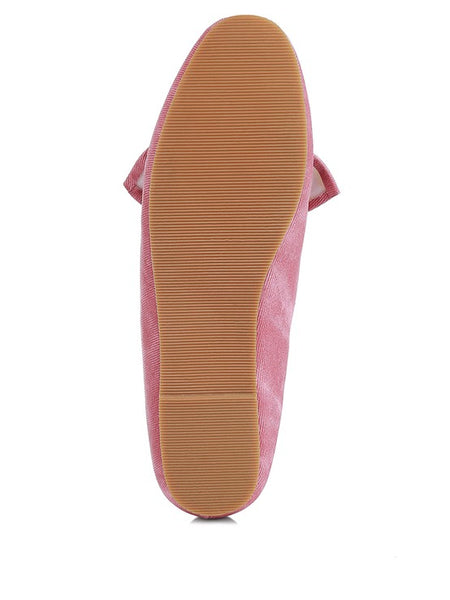 Sole view of women's denim bow loafers by Rag Company in pink with textured rubber outsole