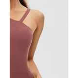 Close-up of Babe Beachwear asymmetrical neck activewear jumpsuit for women in mauve color