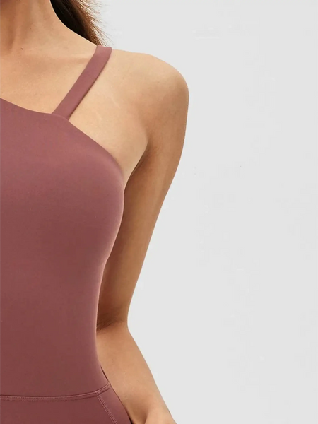 Close-up of Babe Beachwear asymmetrical neck activewear jumpsuit for women in mauve color