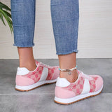 Trendsi affordable summer flat sneakers in pink and white worn with blue jeans for casual style