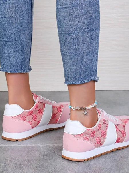 Trendsi affordable summer flat sneakers in pink and white worn with blue jeans for casual style