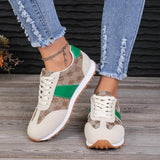 Trendsi affordable summer flat sneakers in beige with green accents and white sole worn with distressed jeans