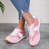 Trendsi affordable summer flat sneakers in pink with white accents and gum sole worn with jeans