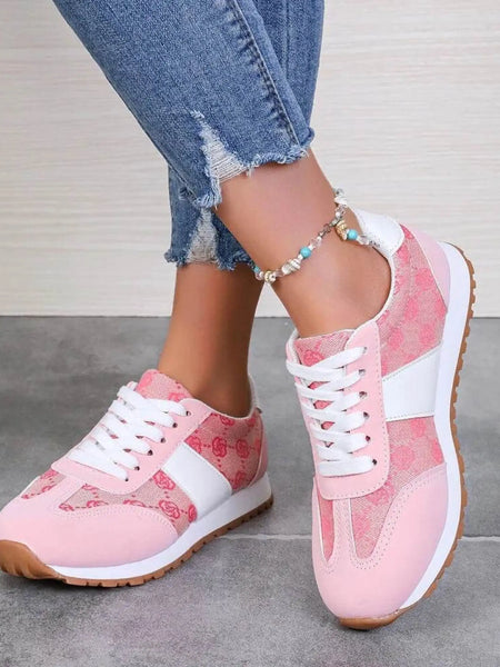 Trendsi affordable summer flat sneakers in pink with white accents and gum sole worn with jeans