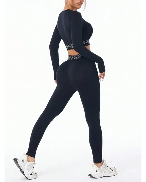 Trendsi black branded leggings and tank outfit active set worn by model with white sneakers