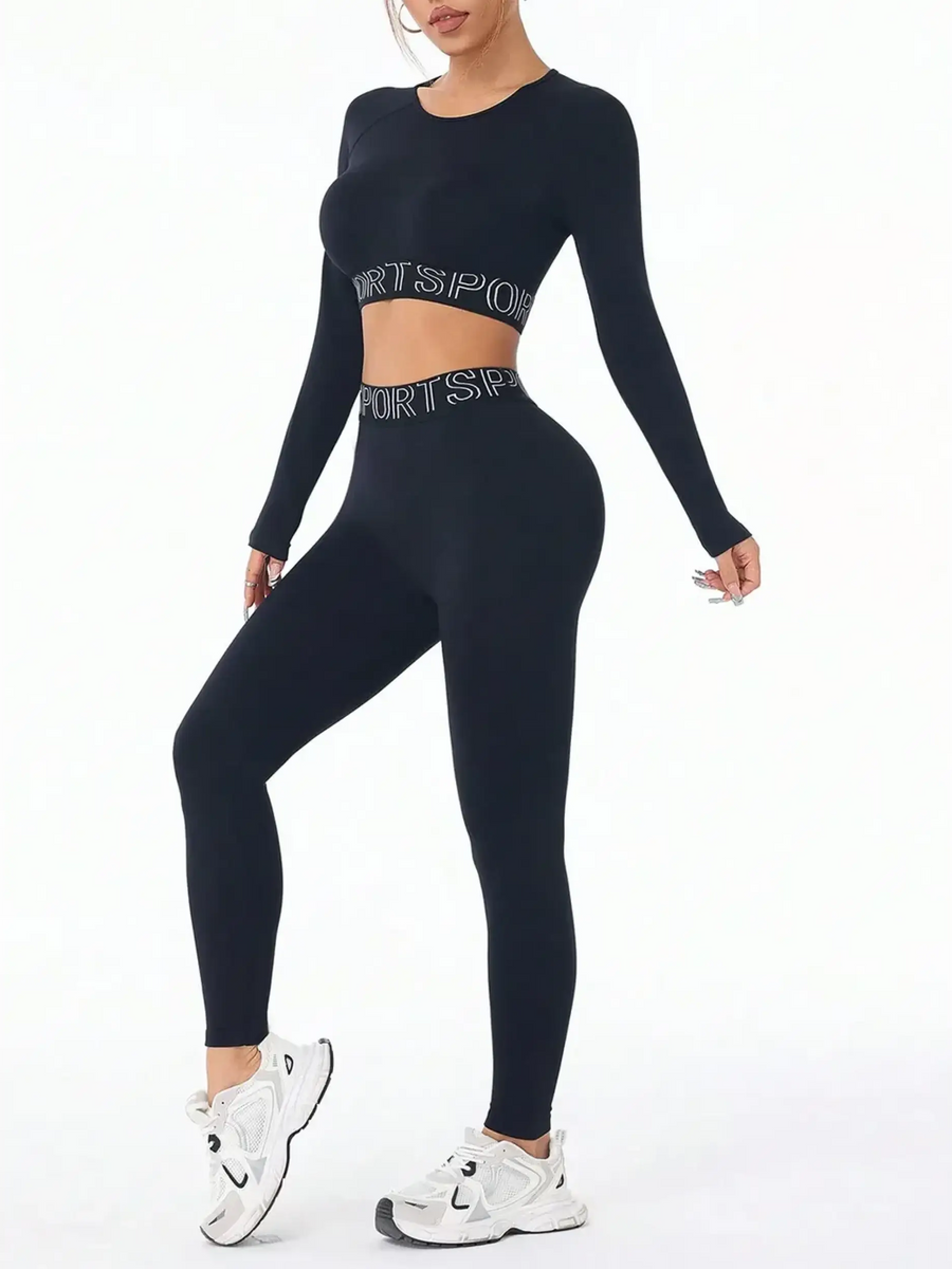 Trendsi active set featuring black branded leggings and tank outfit with long sleeves and white sneakers