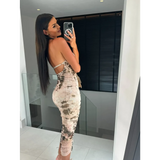 Trendsi backless halter dress midi style with tie-dye pattern worn by woman taking mirror selfie