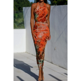 Trendsi backless halter dress midi length with orange and brown tie-dye pattern and fitted silhouette