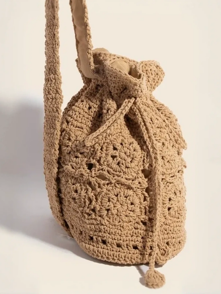 Crochet knit shoulder boho bag with intricate braided drawstring for beach vibes