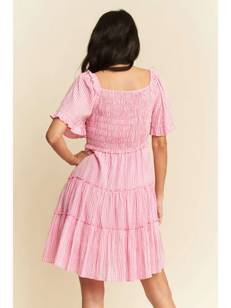 Trendsi midi dress in Barbie pink resort wear with tiered skirt and puff sleeves shown from back